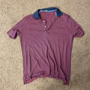 Golf Polo that’s Red and Blue. Not worn much as I grew out of it. Size Medium